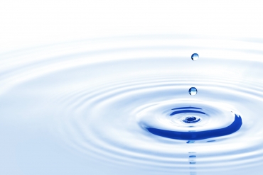 Water drop falling down Blue water drops falling down close up